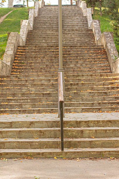 istock Concrete stairs covered with leaves in autumn 2242313019