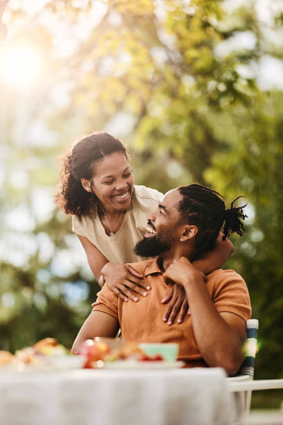 istock Loving black couple talking during a meal in the backyard. 2242316420