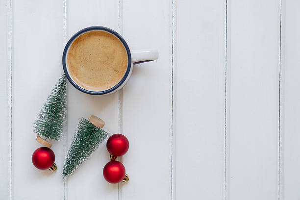 istock Christmas composition with coffee, decorations on a white wooden table. 2242316524