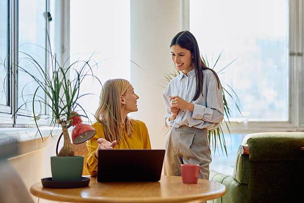 istock Women colleagues collaborating on project in office 2242316604