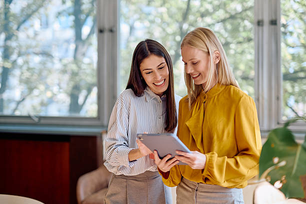 istock Businesswomen collaborating using digital tablet in office 2242316729