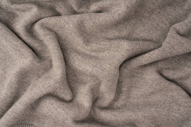 istock Soft grey merino wool sweater texture as a background. 2242318313