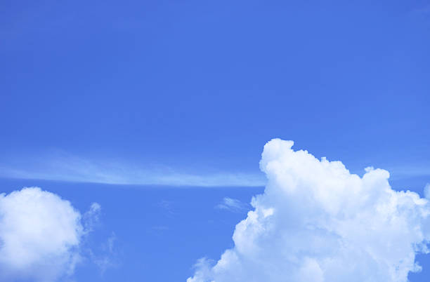 Pure White Fluffy Clouds Floating on Vibrant Blue Sky