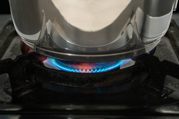 istock An orange flame on a gas stove typically indicates incomplete combustion, due to an improper air-to-fuel mixture or clogged burners. 2242321855