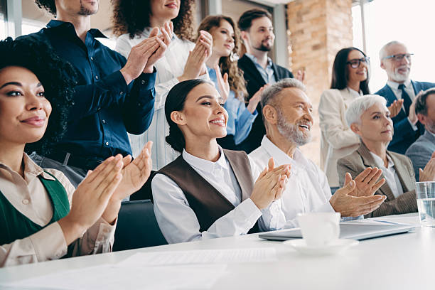 istock Diverse business team applauding during a meeting in a modern office, showcasing teamwork and professional collaboration indoors 2242324048