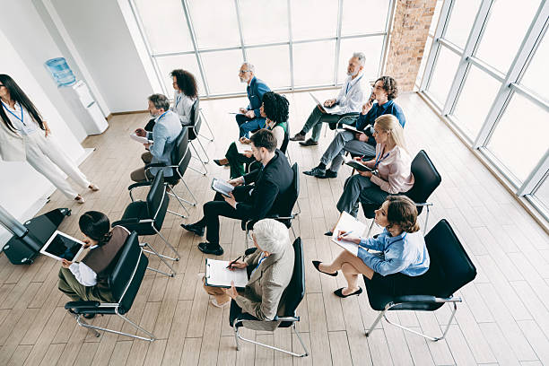istock Group of professionals during a corporate training session in a modern office setting with natural light 2242324272