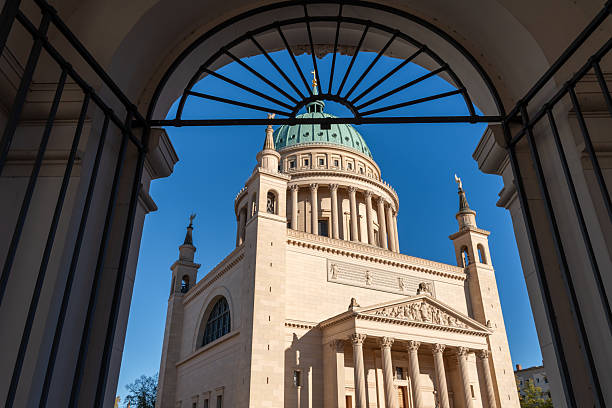 Germany, Potsdam, Downtown, October 18, 2025 - St. Nicholas Church behind an archway