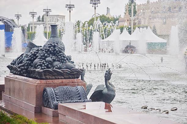 A fountain is flushing of in front of other flushed background.