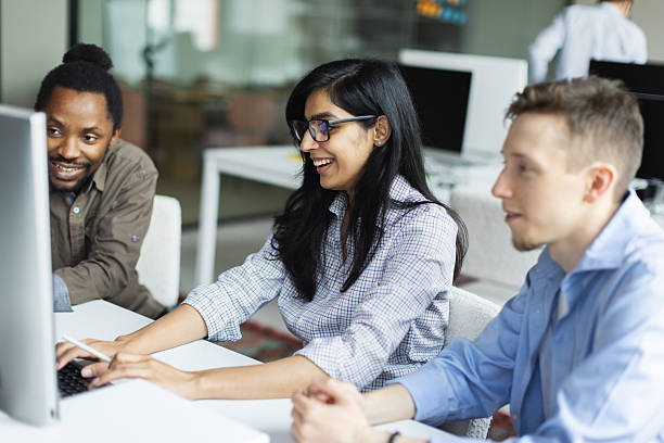 istock Three  young adult colleagues collaborating 2242328127