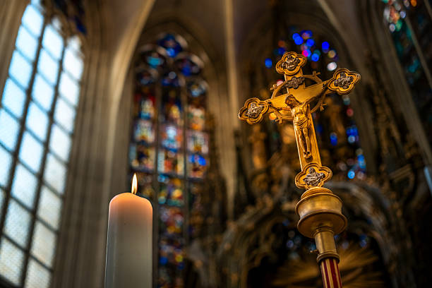 Backgrounds of religious cross and defocused lights.