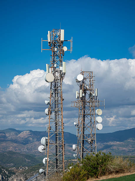 istock Telecommunication Towers with Antennas Under Blue Sky 2242328495