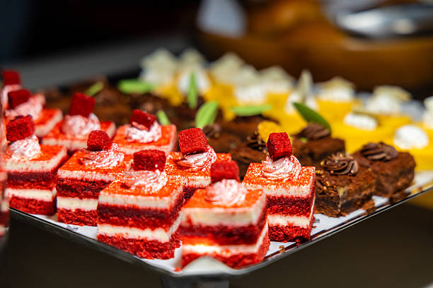 istock Assorted desserts on tray, featuring vibrant red velvet cakes with 2242328699