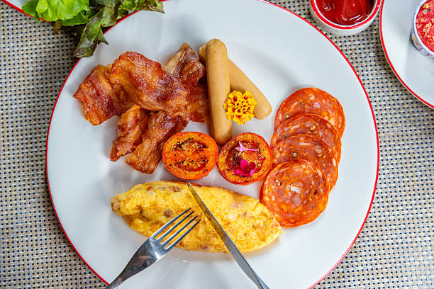 Delicious breakfast platter featuring crispy bacon, sausage, chorizo,