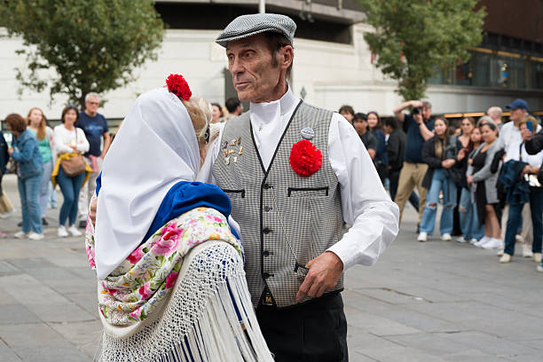 Madrid, Spain. October 19th 2025. El chotis, typical dance of Madrid, Spain, an exhibition of some couples of people dressed with traditional costumes with a lot of people watching them.