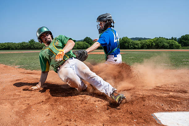 istock Baseball Catcher Tagging Runner During Intense Game Moment 2242331551