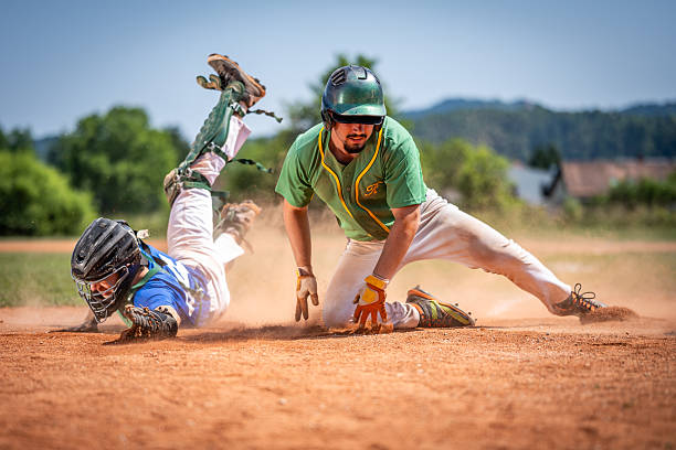 istock Caucasian Baseball Player Skillfully Securing Home Plate in Game 2242331563