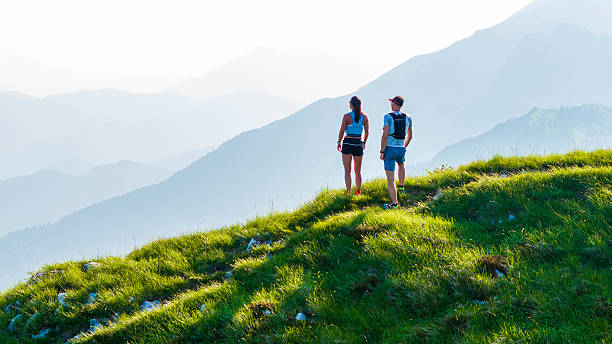 istock Caucasian Runners Relishing Summit Panorama 2242333138