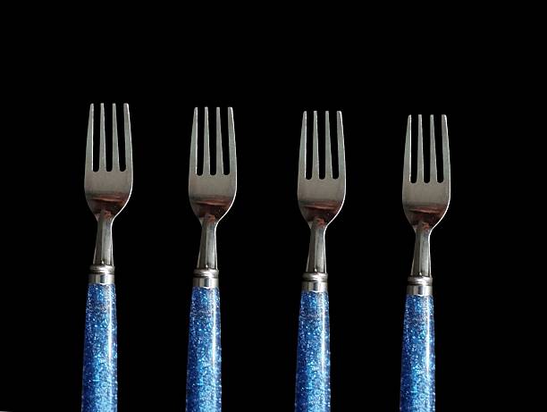 Silver fork on yellow