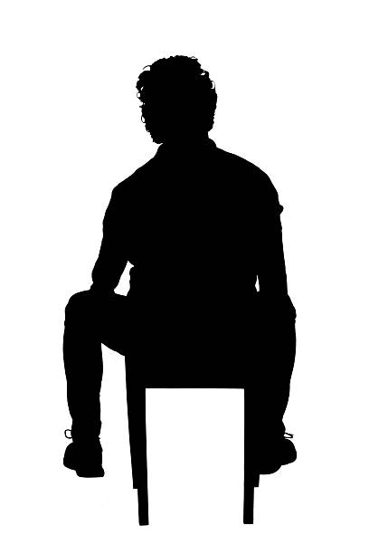 istock silhouette of back view of a man sitting on chair on white background 2242336395