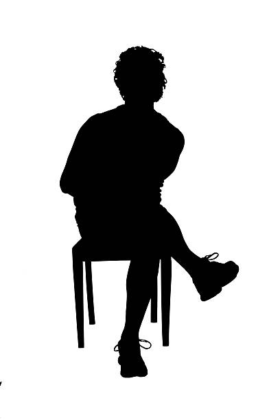 istock silhouette of a front view of a man sitting on chair on white background, 2242336555