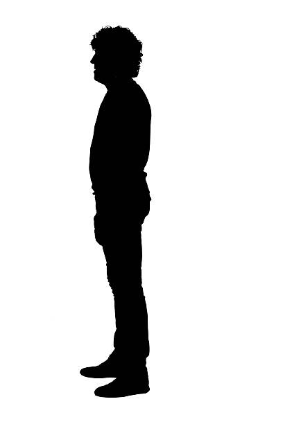 istock silhouette of side view of a man standing on white background 2242336574