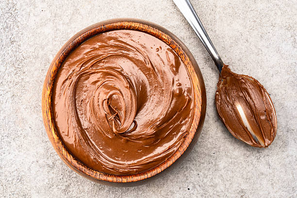 istock Cream chocolate in a bowl on a vintage background 2242336604