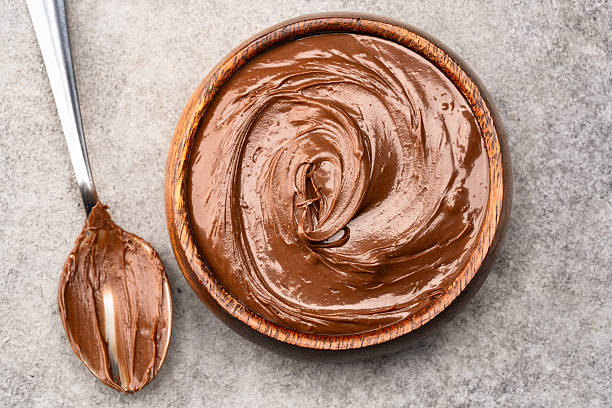 istock Cream chocolate in a bowl on a vintage background 2242336605