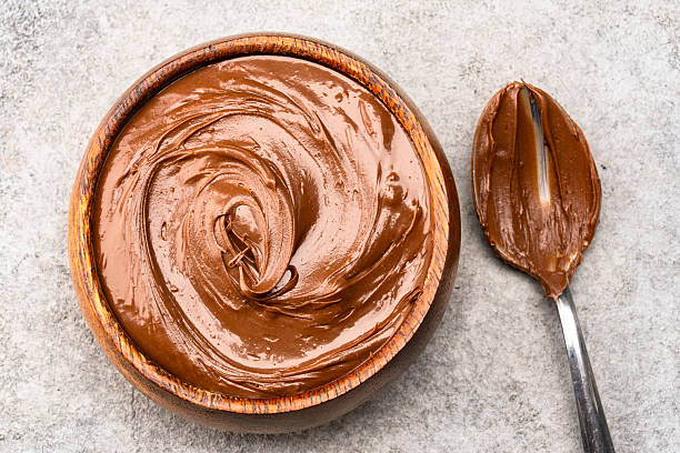 istock Cream chocolate in a bowl on a vintage background 2242336606