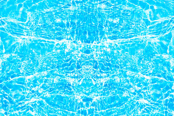 istock Blue water with ripples on the surface. Defocus blurred transparent blue colored clear calm water surface texture with splashes and bubbles. Water waves with shining pattern texture background. 2242337343
