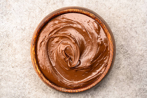 istock Cream chocolate in a bowl on a vintage background 2242337749
