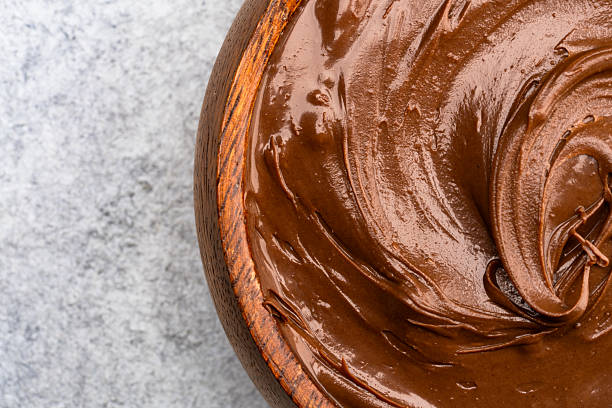 istock Cream chocolate in a bowl on a vintage background 2242337750