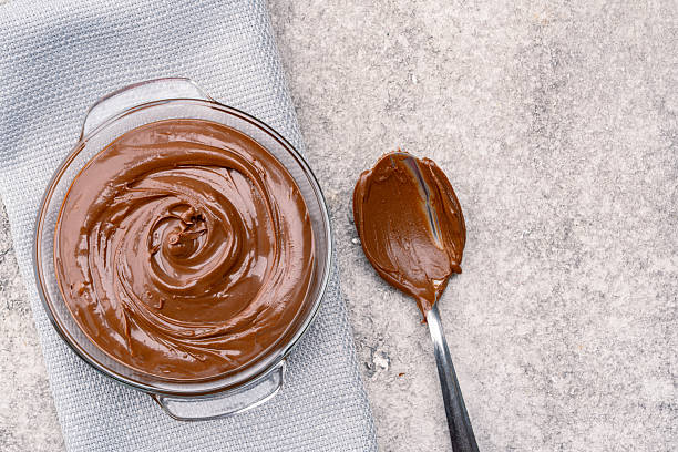istock Cream chocolate in a bowl on a vintage background 2242337989