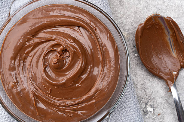 istock Cream chocolate in a bowl on a vintage background 2242338033