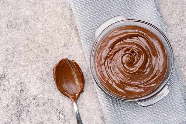 istock Cream chocolate in a bowl on a vintage background 2242338051