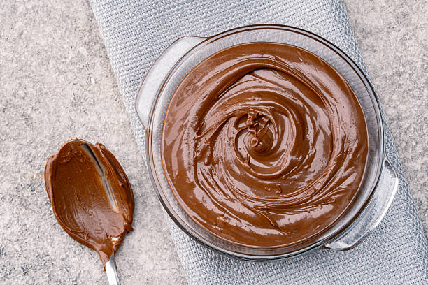 istock Cream chocolate in a bowl on a vintage background 2242338067