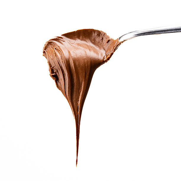 istock Cream chocolate in a spoon on a white background 2242338212