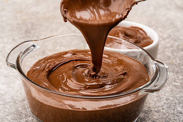 istock Cream chocolate in a bowl on a vintage background 2242338214