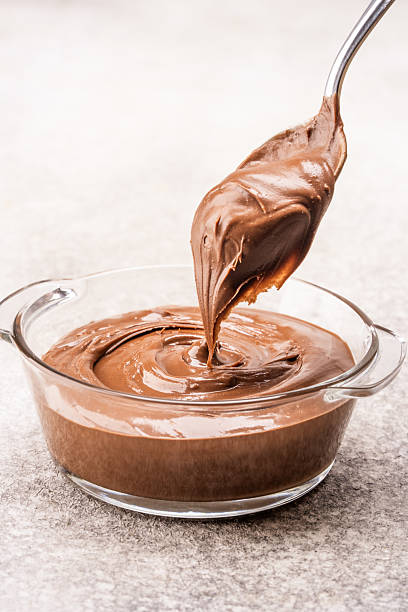 istock Cream chocolate in a bowl on a vintage background 2242338272