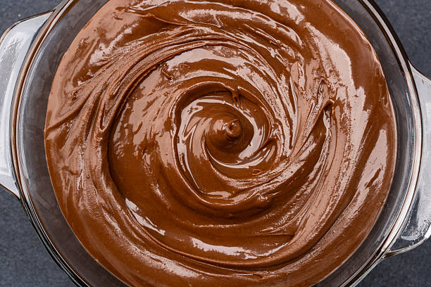 istock Cream chocolate in a bowl on a black background 2242338356