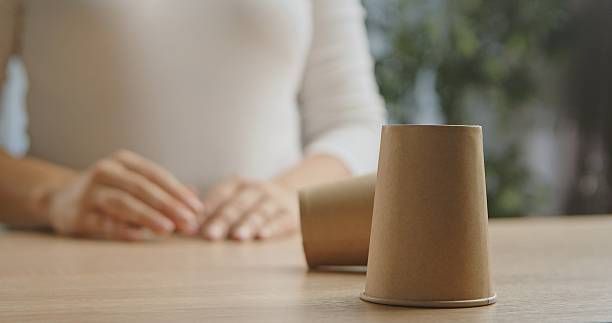 istock Eco Friendly Disposable Paper Cups on Wooden Table 2242340151