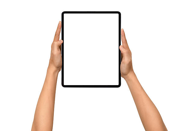 istock Close-up of hands holding a modern tablet with blank screen isolated on white background. High quality studio shot. Concept for technology, business, finance, advertising and public relations. 2242340596