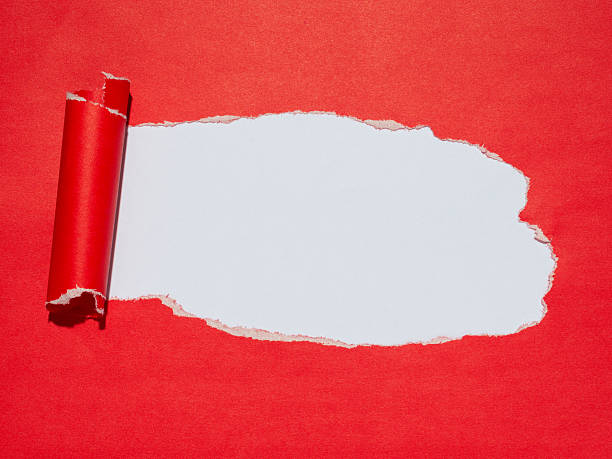 istock Torn red paper reveals a white background underneath. 2242341388
