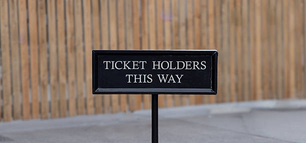 istock Ticket Holders This Way sign - white text on black background 2242342076