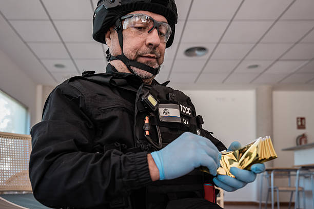 istock Police officer securing evidence during crime scene investigation 2242343259