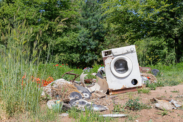 istock Abandoned Washing Machine on the ground in the countryside. 2242344973