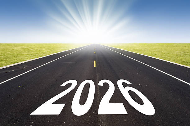 istock 2026 road perspective with rising sun, new year greetings 2242345444