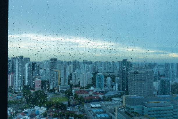 istock Rain Droplets on the Singapore skyline 2242348702