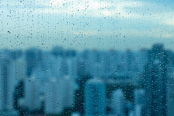 istock Rain Droplets on the Singapore skyline 2242348707