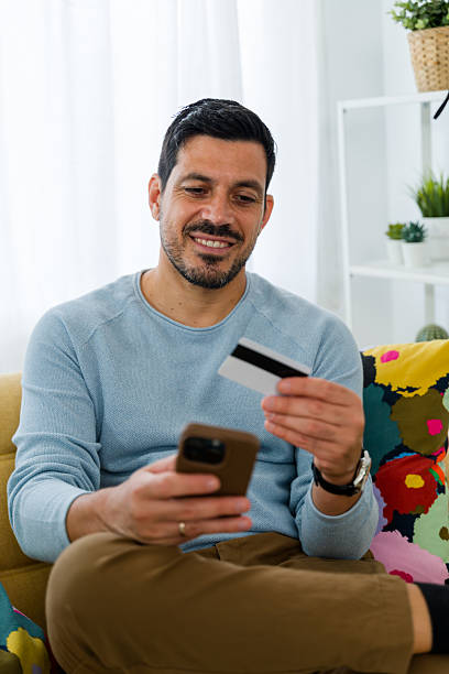 istock Man doing online shopping making credit card payment on smartphone 2242354806