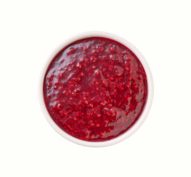 istock raspberry jam in a white ceramic  bowl isolated on white background, top view. 2242356499